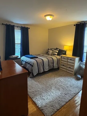 a bed room with a bed and a flat screen tv