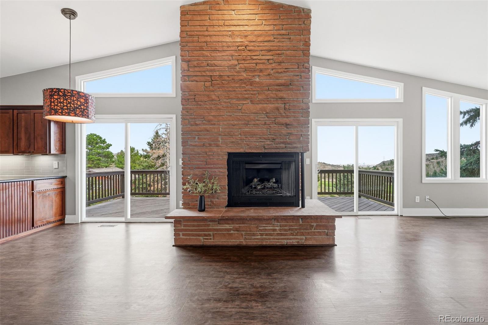 15743 Wedge Way Morrison, CO 80465 - Photo 11 of 48 a living room with furniture and a fireplace