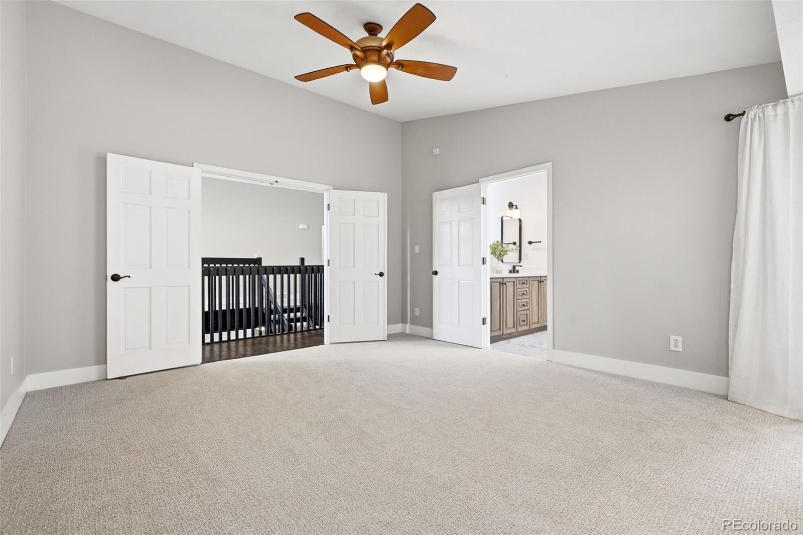 15743 Wedge Way Morrison, CO 80465 - Photo 21 of 48 a view of empty room with ceiling fan