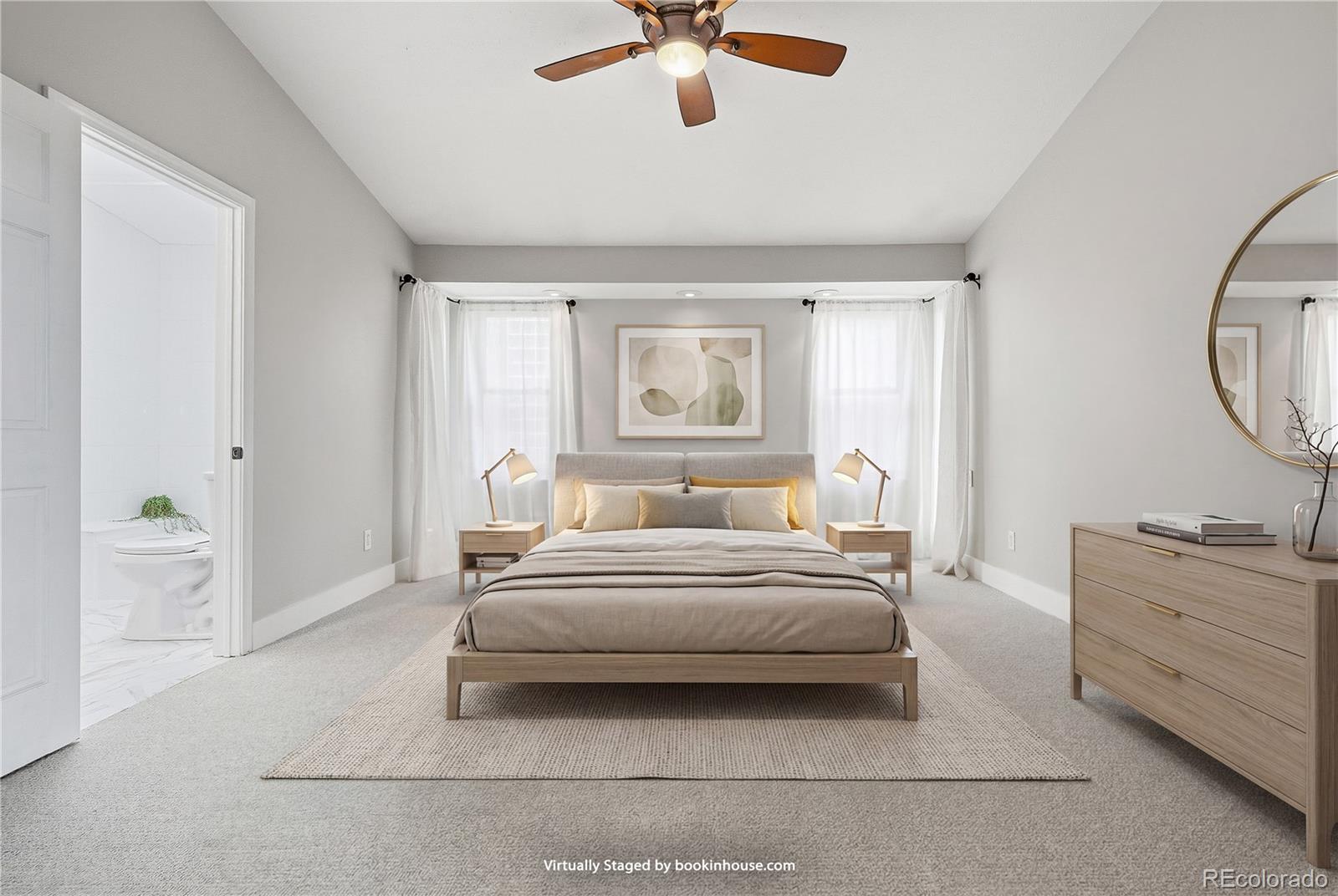 15743 Wedge Way Morrison, CO 80465 - Photo 4 of 48 a spacious bedroom with a bed and a chandelier