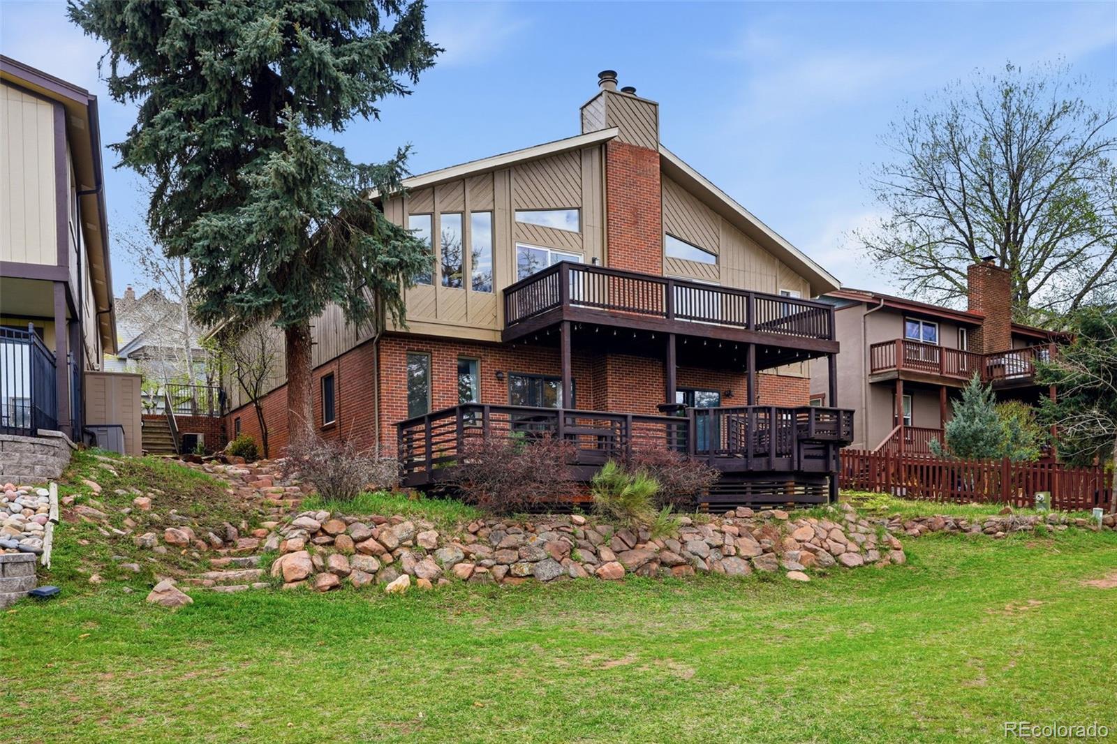 15743 Wedge Way Morrison, CO 80465 - Photo 43 of 48 a view of house with a yard