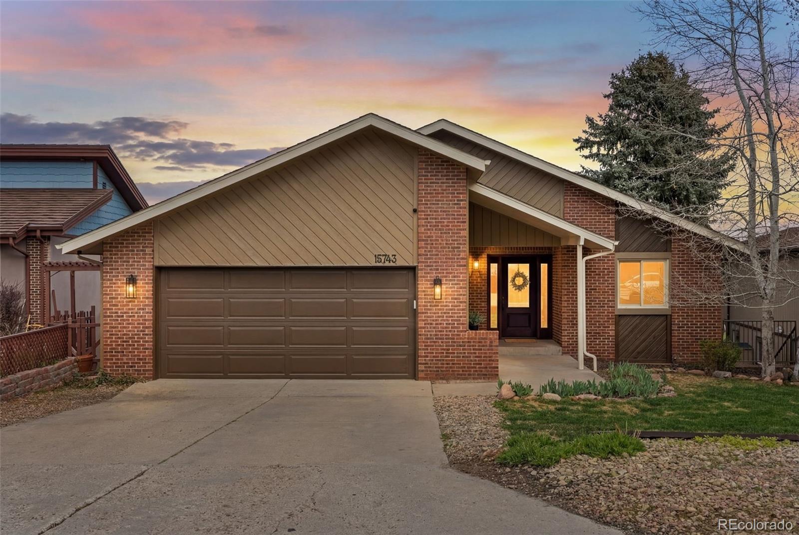 15743 Wedge Way Morrison, CO 80465 - Photo 44 of 48 a front view of a house with a yard