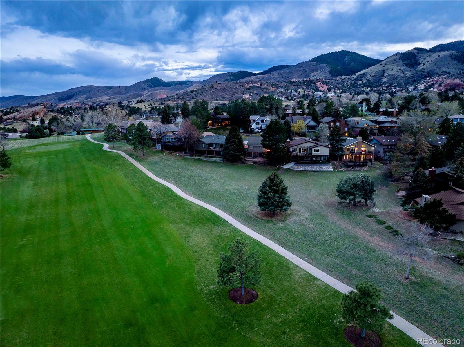 15743 Wedge Way Morrison, CO 80465 - Photo 7 of 48 a view of a garden with a lake