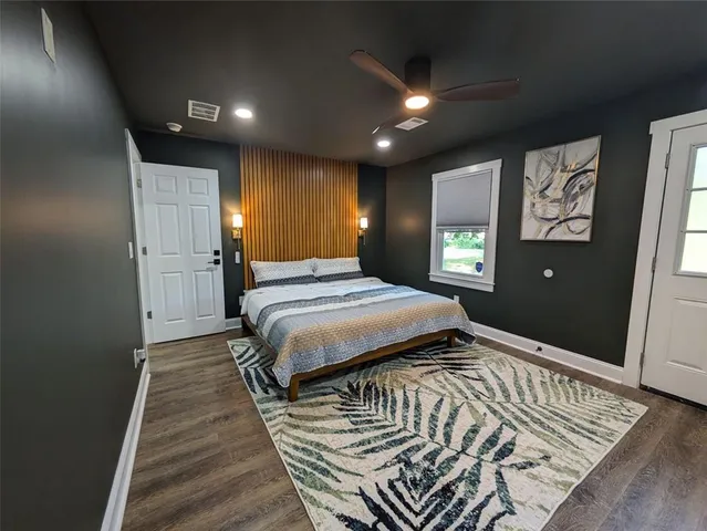 a bedroom with a bed and a walk in closet