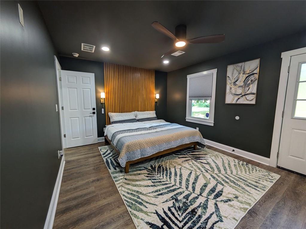 a bedroom with a bed and a walk in closet