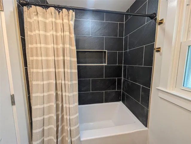 a bathroom with a bathtub