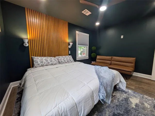 a bedroom with bed and window