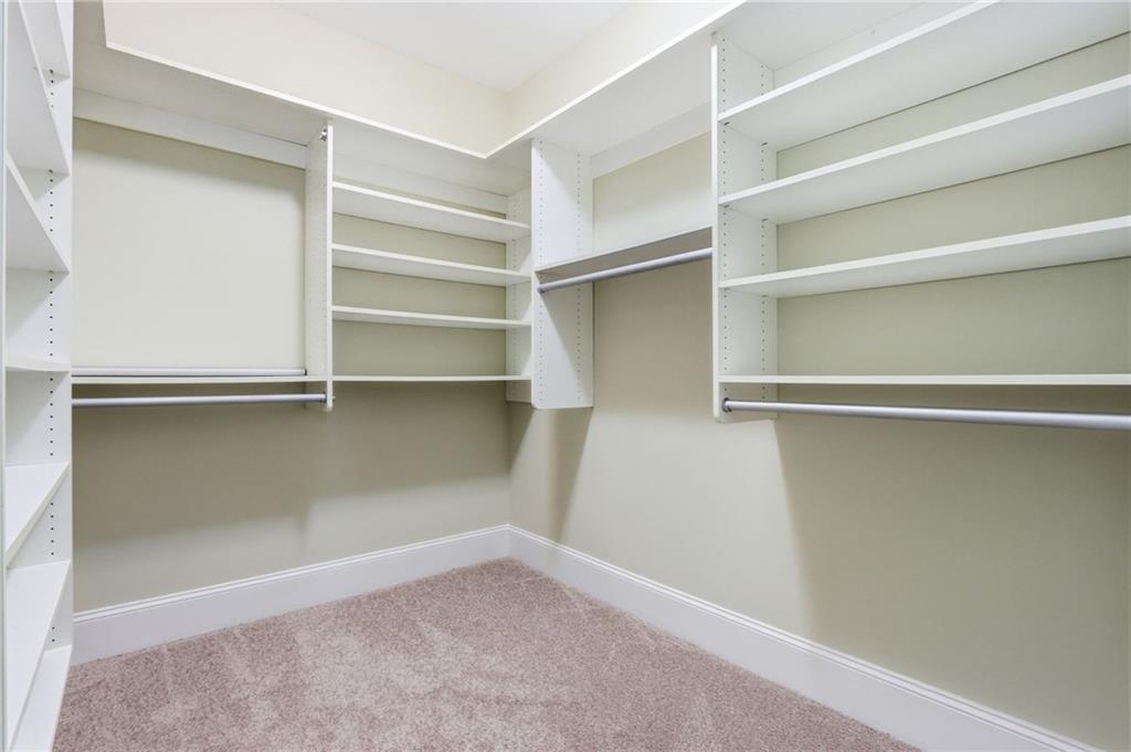 1515 Riva Ridge Suwanee, GA 30024 - Photo 19 of 35 a view of an empty walk in closet