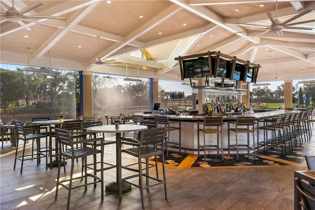 a dining space with lots of chairs and a table