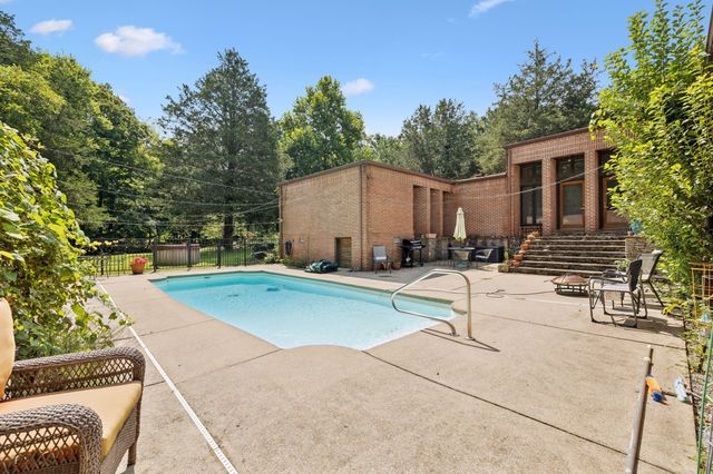 a view of a park that has large trees