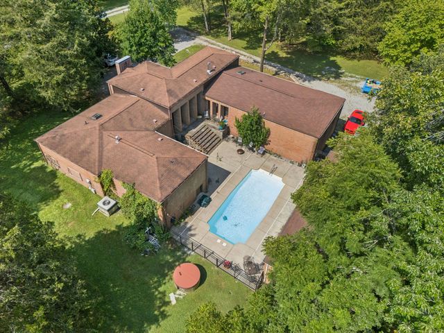 an aerial view of a house with garden space and street view