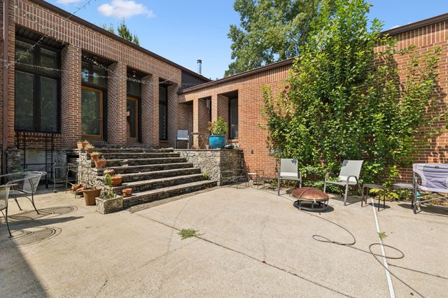 a view of swimming pool with outdoor seating