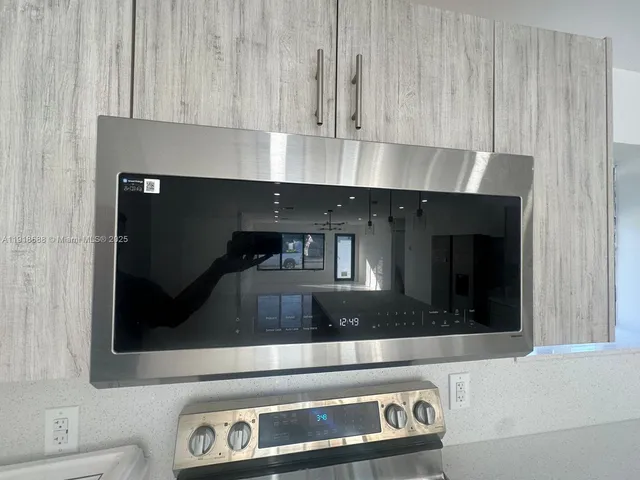 a kitchen with a stove and cabinets