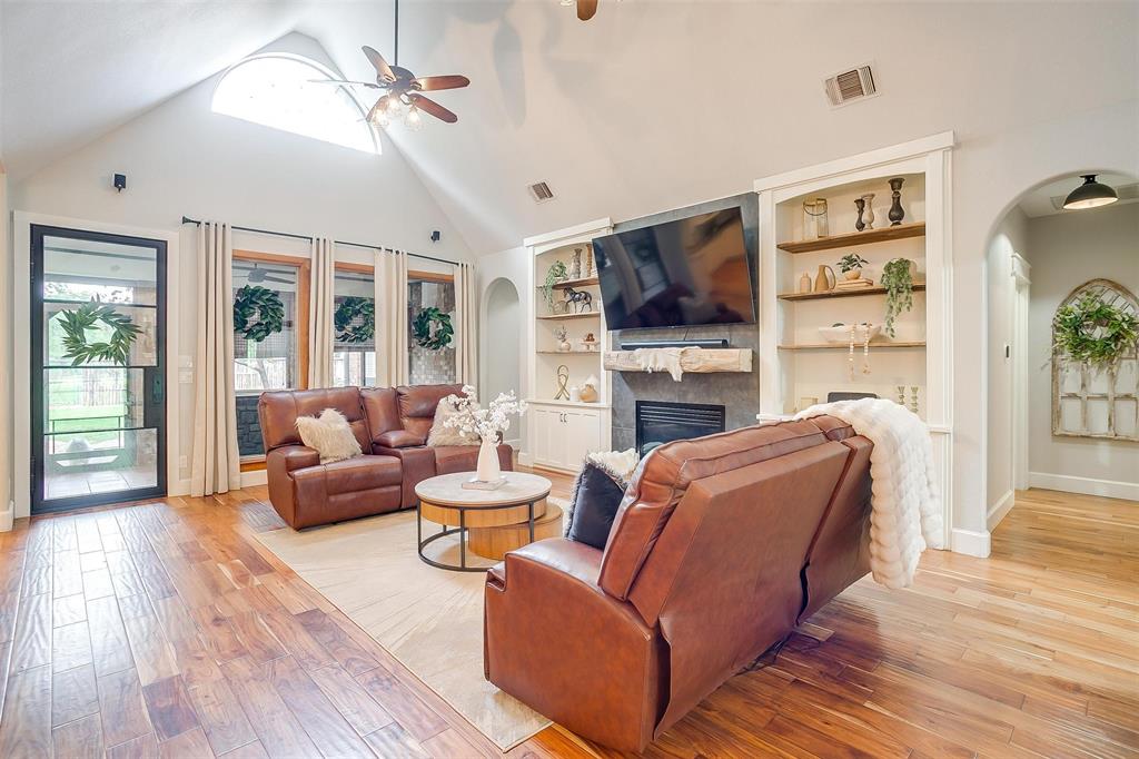 4962 Farm To Market 113 Millsap, TX 76066 - Photo 11 of 36 a living room with fireplace furniture and a flat screen tv
