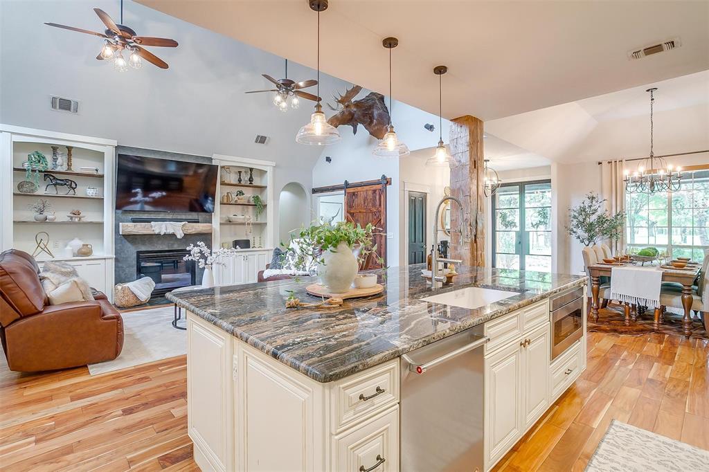 4962 Farm To Market 113 Millsap, TX 76066 - Photo 36 of 36 a open kitchen with stainless steel appliances granite countertop a stove and a living room