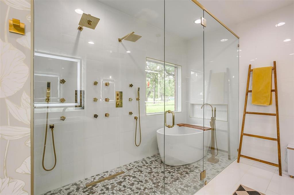 4962 Farm To Market 113 Millsap, TX 76066 - Photo 18 of 36 a bathroom with a bathtub and shower