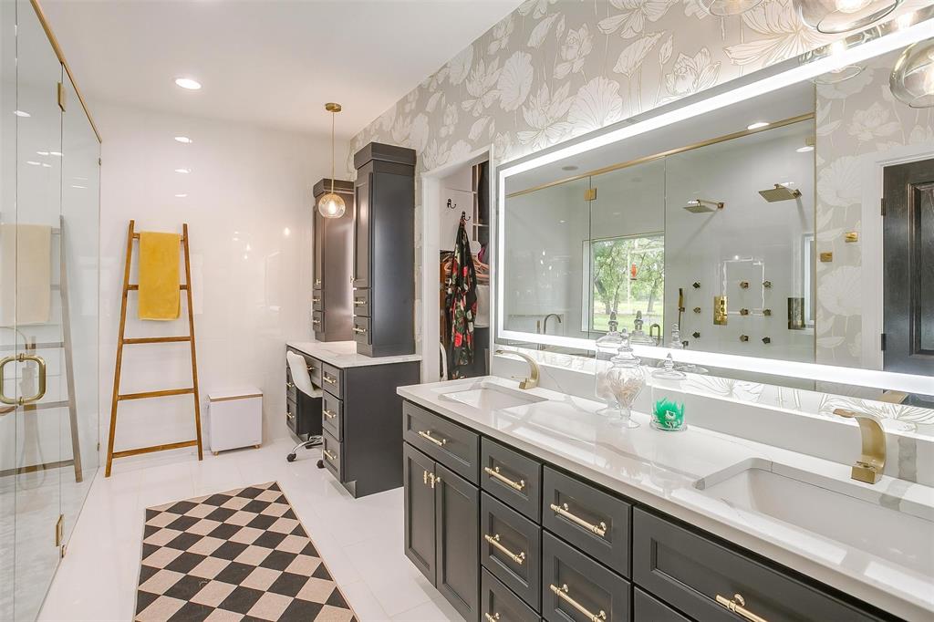 4962 Farm To Market 113 Millsap, TX 76066 - Photo 19 of 36 a spacious bathroom with a double vanity sink a mirror and a bathtub