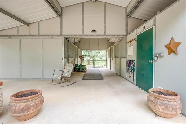 a room with gym equipment and a large window