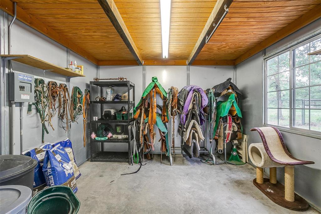 4962 Farm To Market 113 Millsap, TX 76066 - Photo 28 of 36 a view of a room with gym equipment