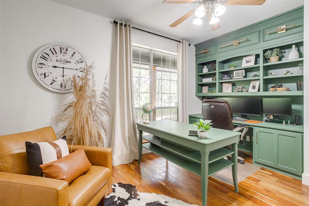 4962 Farm To Market 113 Millsap, TX 76066 - Photo 33 of 36 a living room with furniture a window and a clock