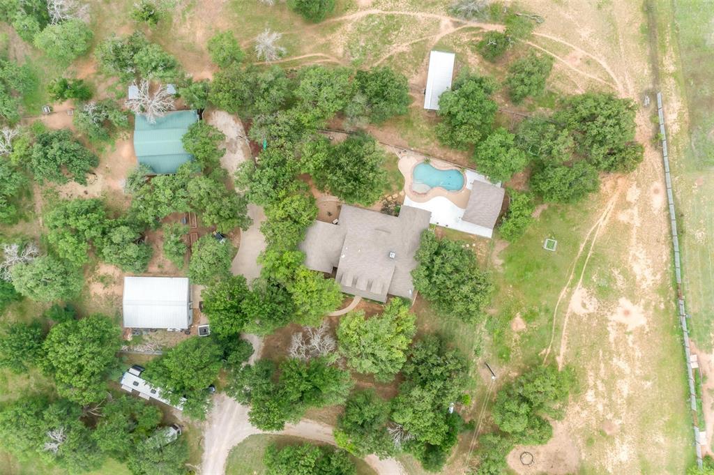 4962 Farm To Market 113 Millsap, TX 76066 - Photo 4 of 36 an aerial view of residential house with outdoor space and trees all around