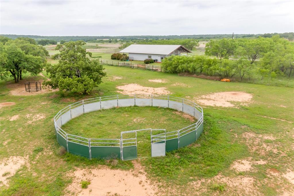 4962 Farm To Market 113 Millsap, TX 76066 - Photo 7 of 36 a view of a swimming pool with an outdoor space and seating area