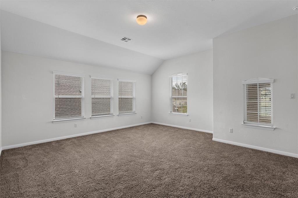 236 Prato Place Georgetown, TX 78628 - Photo 26 of 40 A spacious, naturally illuminated room featuring abundant windows and cozy carpeting.