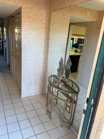 a view of a hallway with seating area