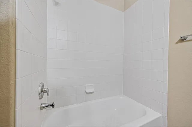 a bath tub sitting in a bathroom