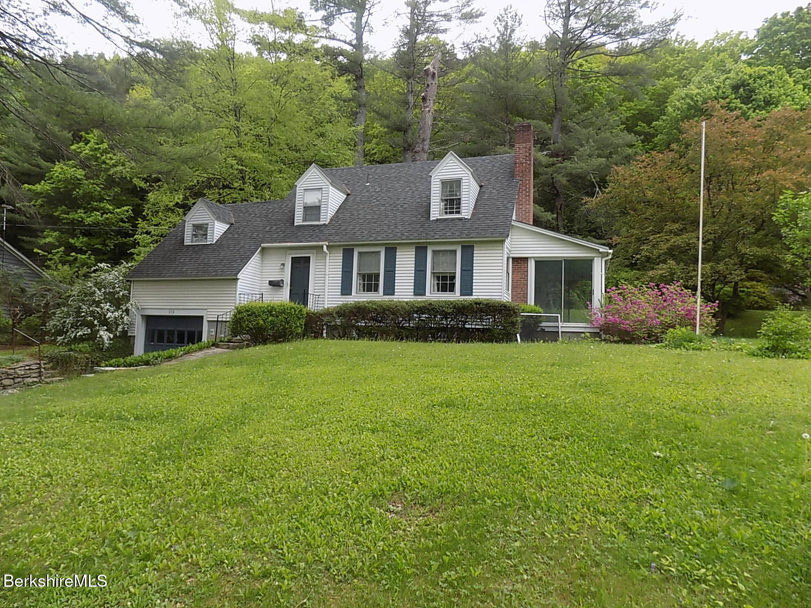 350 Laurel Street Lee, MA 01238 - Photo 1 of 34 a front view of a house with a garden