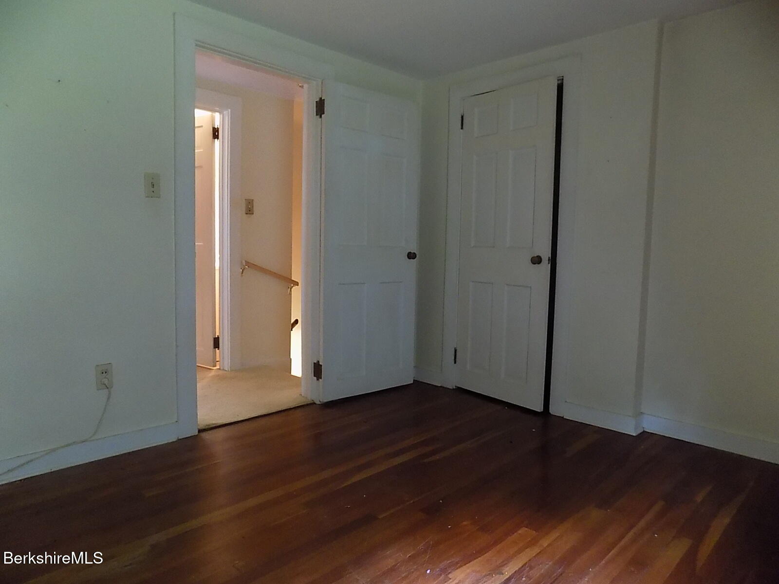 350 Laurel Street Lee, MA 01238 - Photo 17 of 34 a view of an empty room with wooden floor and a window