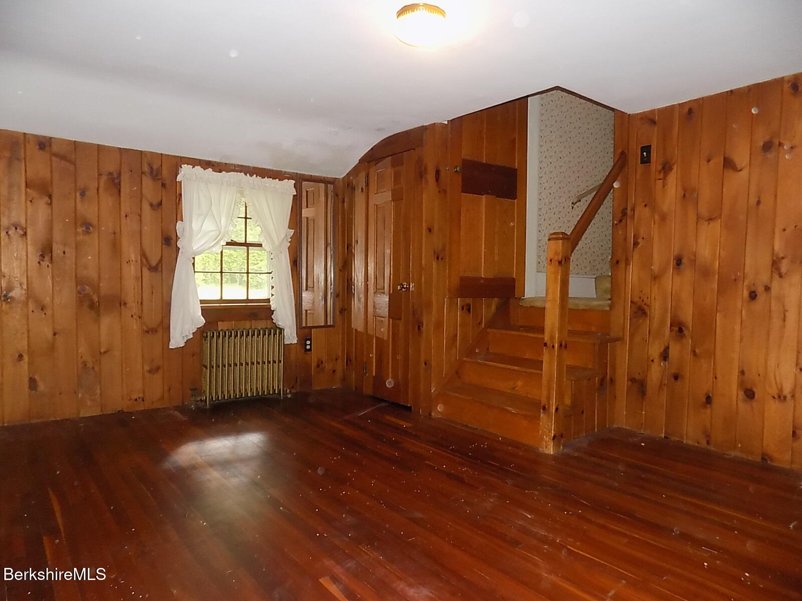 350 Laurel Street Lee, MA 01238 - Photo 18 of 34 a view of an empty room with wooden floor and a window
