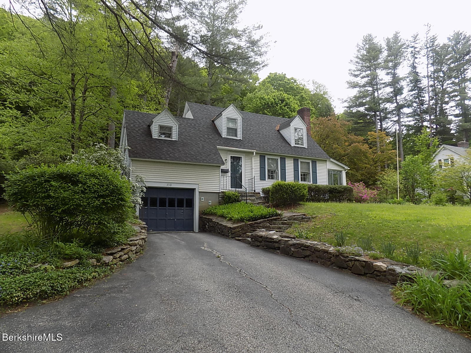 350 Laurel Street Lee, MA 01238 - Photo 30 of 34 a front view of a house with a garden and yard