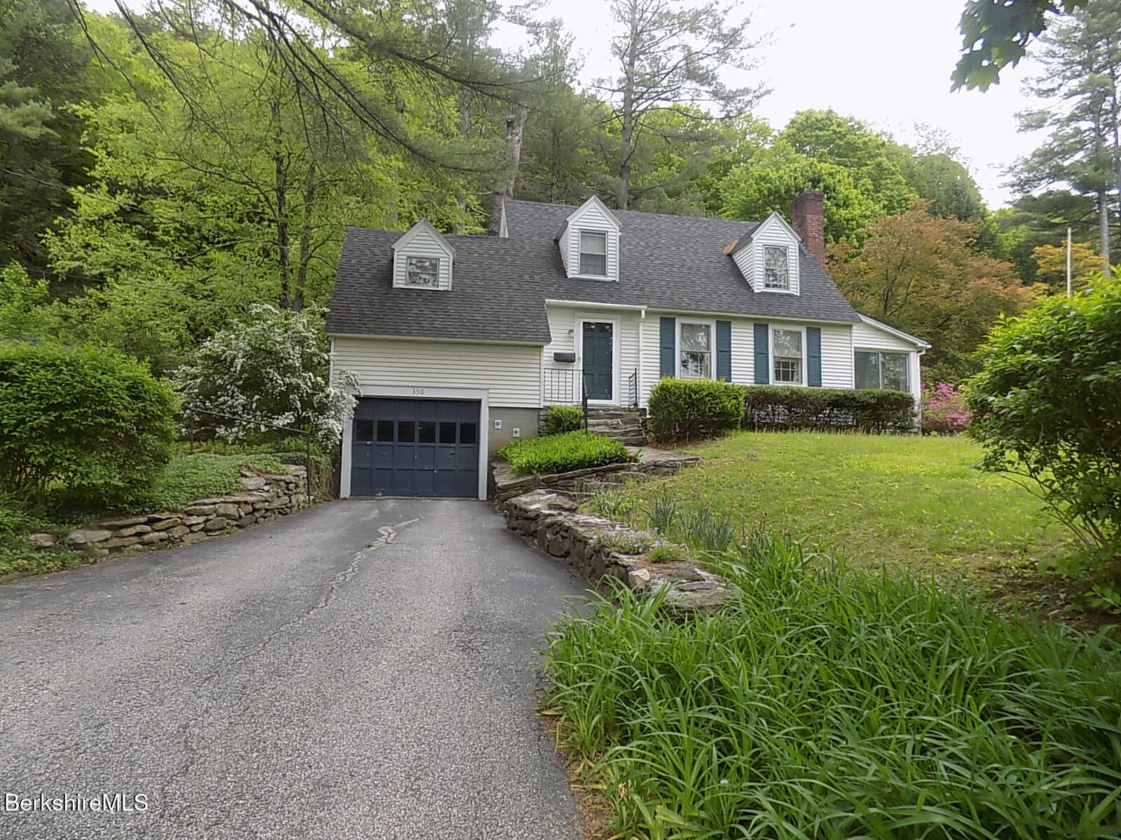 350 Laurel Street Lee, MA 01238 - Photo 31 of 34 a front view of a house with a yard and garage