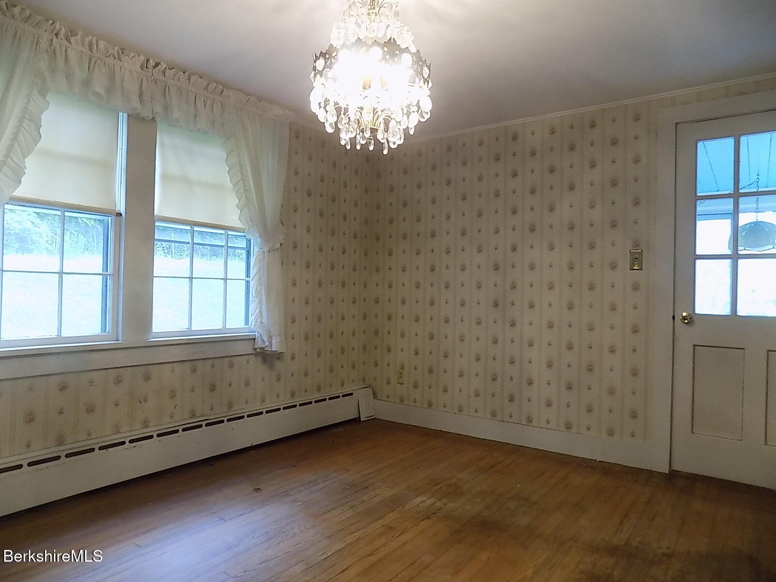 350 Laurel Street Lee, MA 01238 - Photo 6 of 34 an empty room with wooden floor and windows