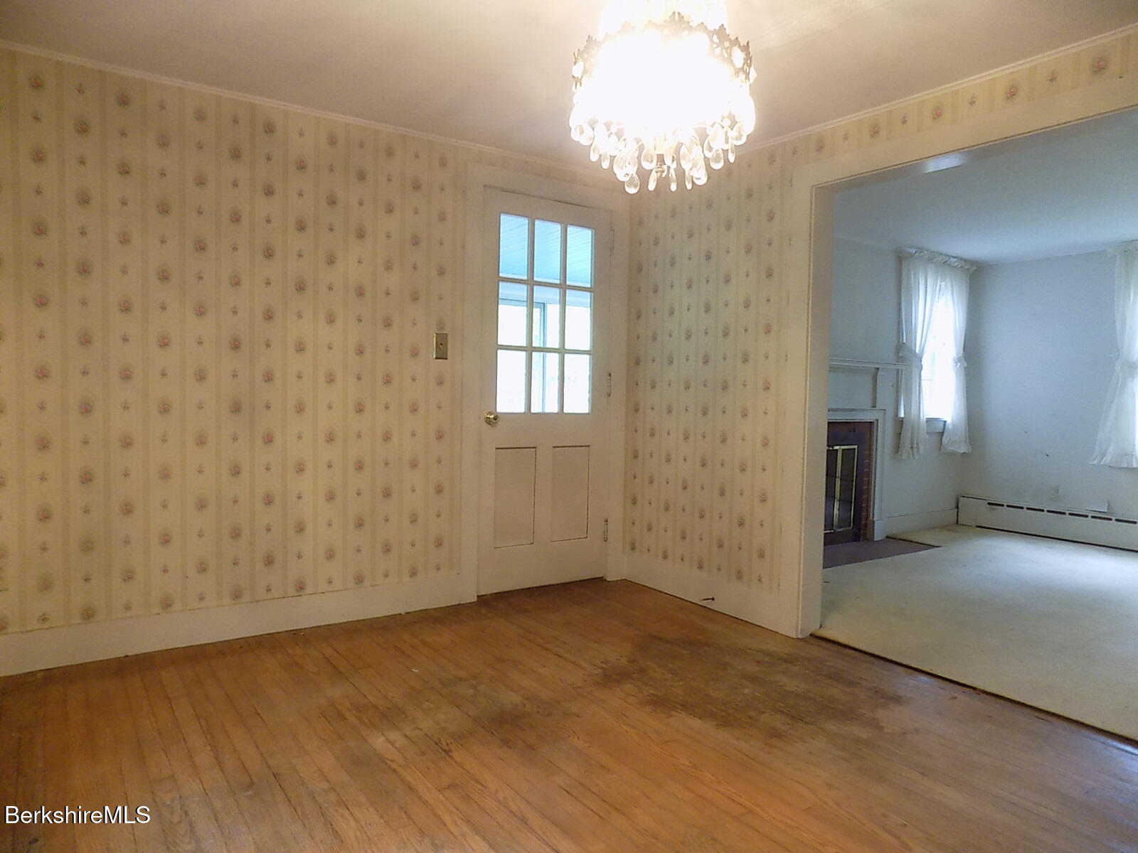 350 Laurel Street Lee, MA 01238 - Photo 7 of 34 an empty room with chandelier fan