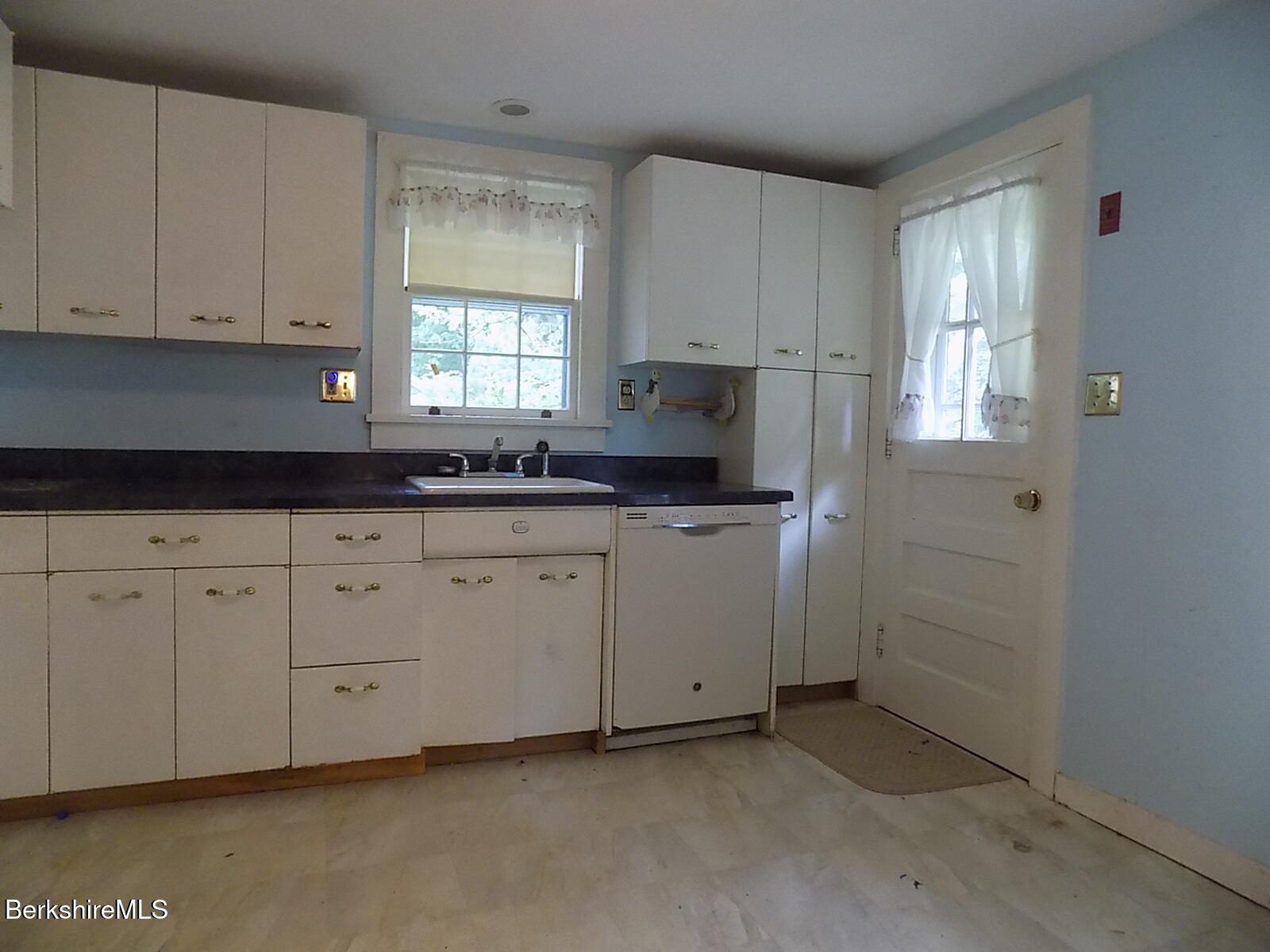 350 Laurel Street Lee, MA 01238 - Photo 8 of 34 a kitchen with cabinets appliances a sink and a window