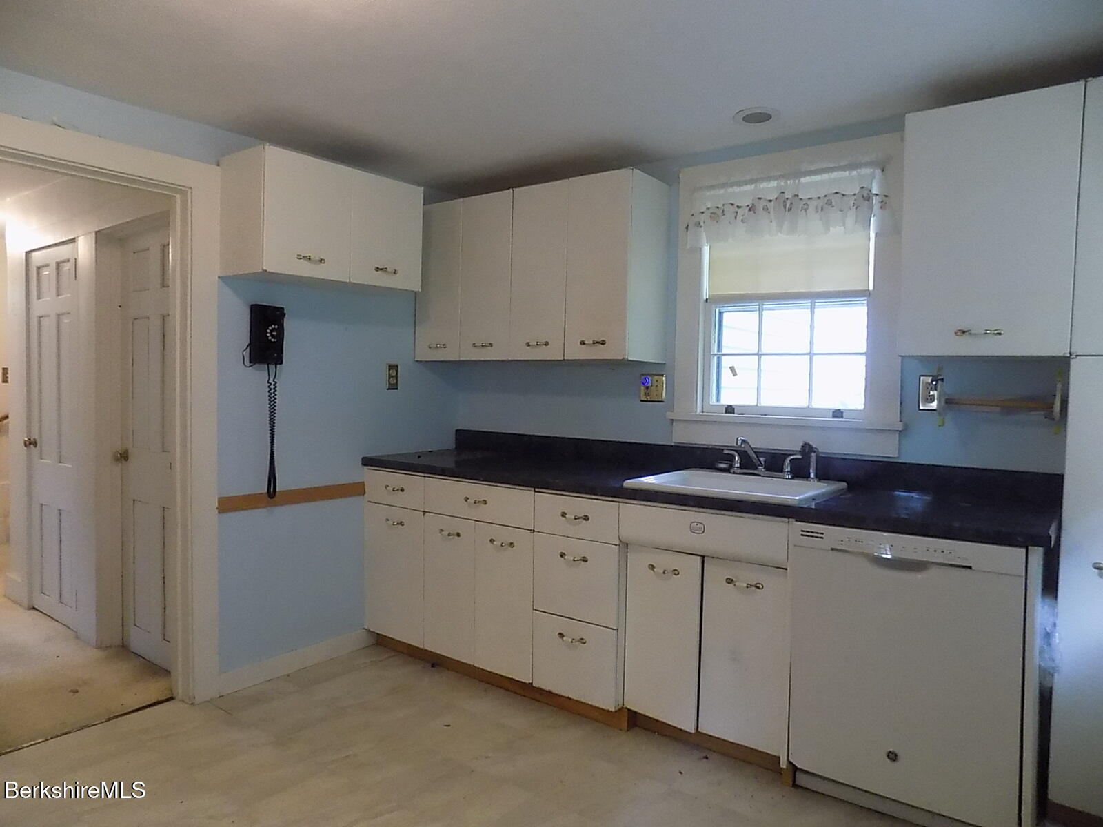 350 Laurel Street Lee, MA 01238 - Photo 9 of 34 a kitchen with cabinets appliances a sink and a window