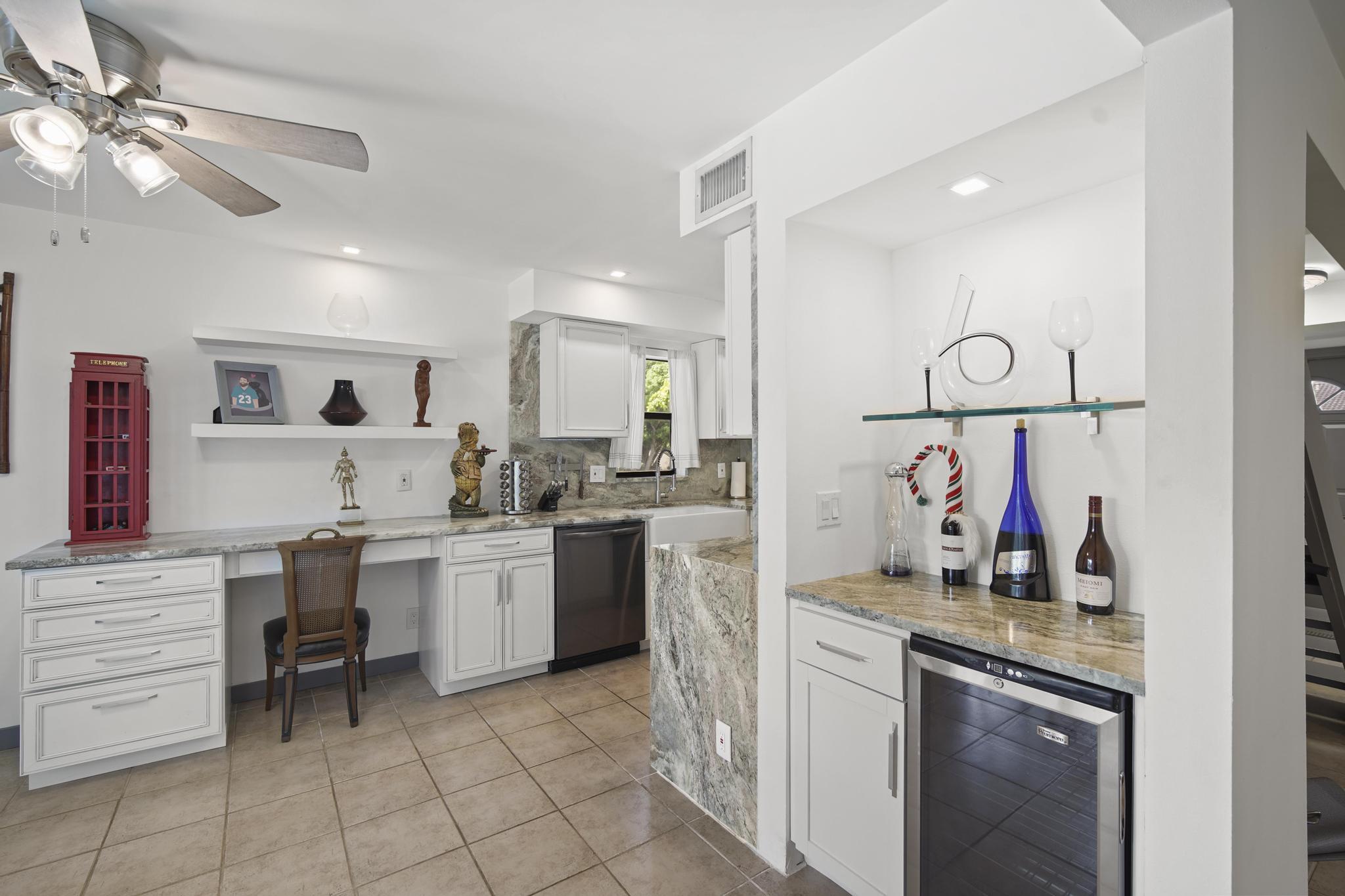 149 Northwest 70th Street, Unit 214C Boca Raton, FL 33487 - Photo 11 of 35 a kitchen with a cabinets and chandelier