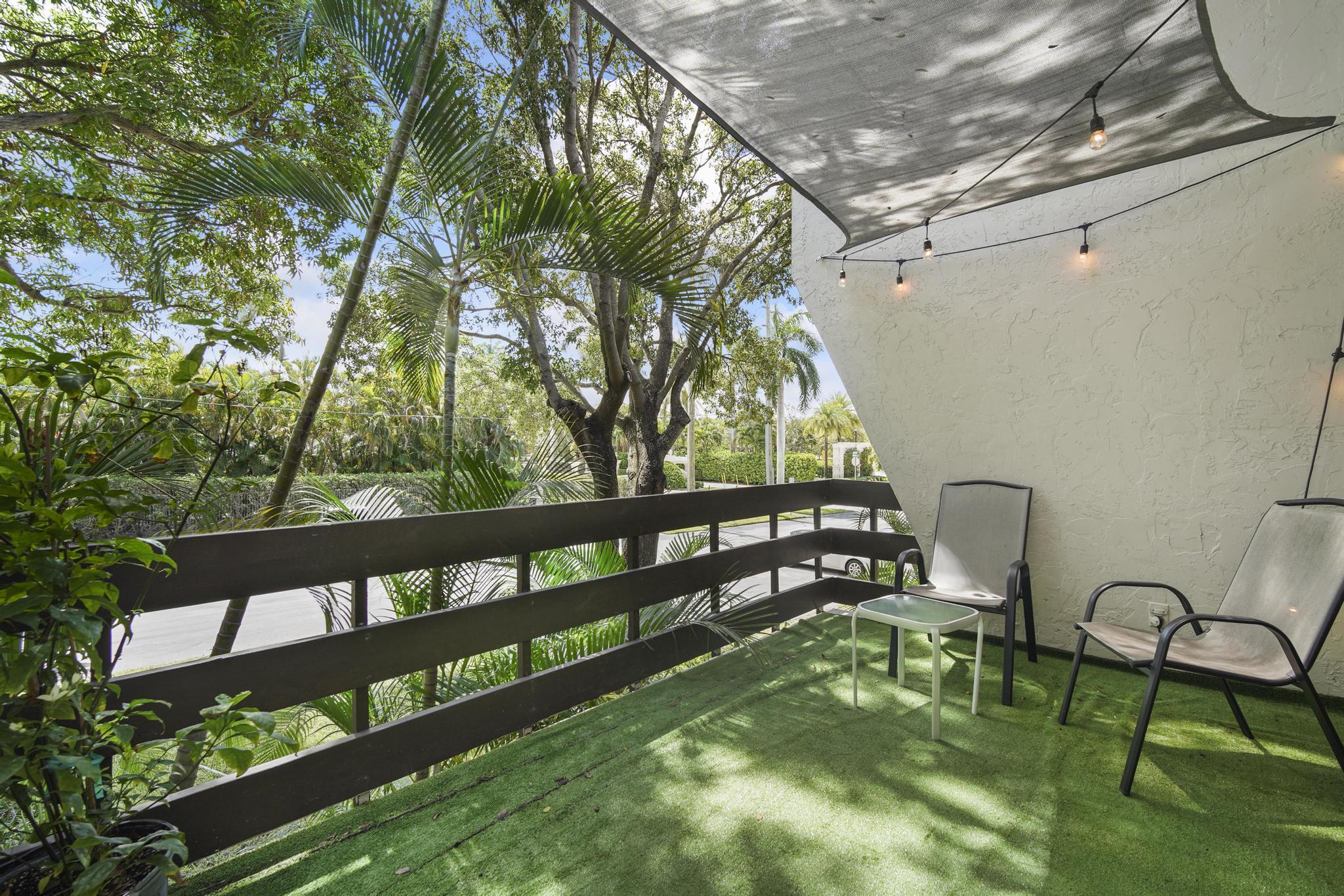 149 Northwest 70th Street, Unit 214C Boca Raton, FL 33487 - Photo 15 of 35 a view of a bench in the backyard