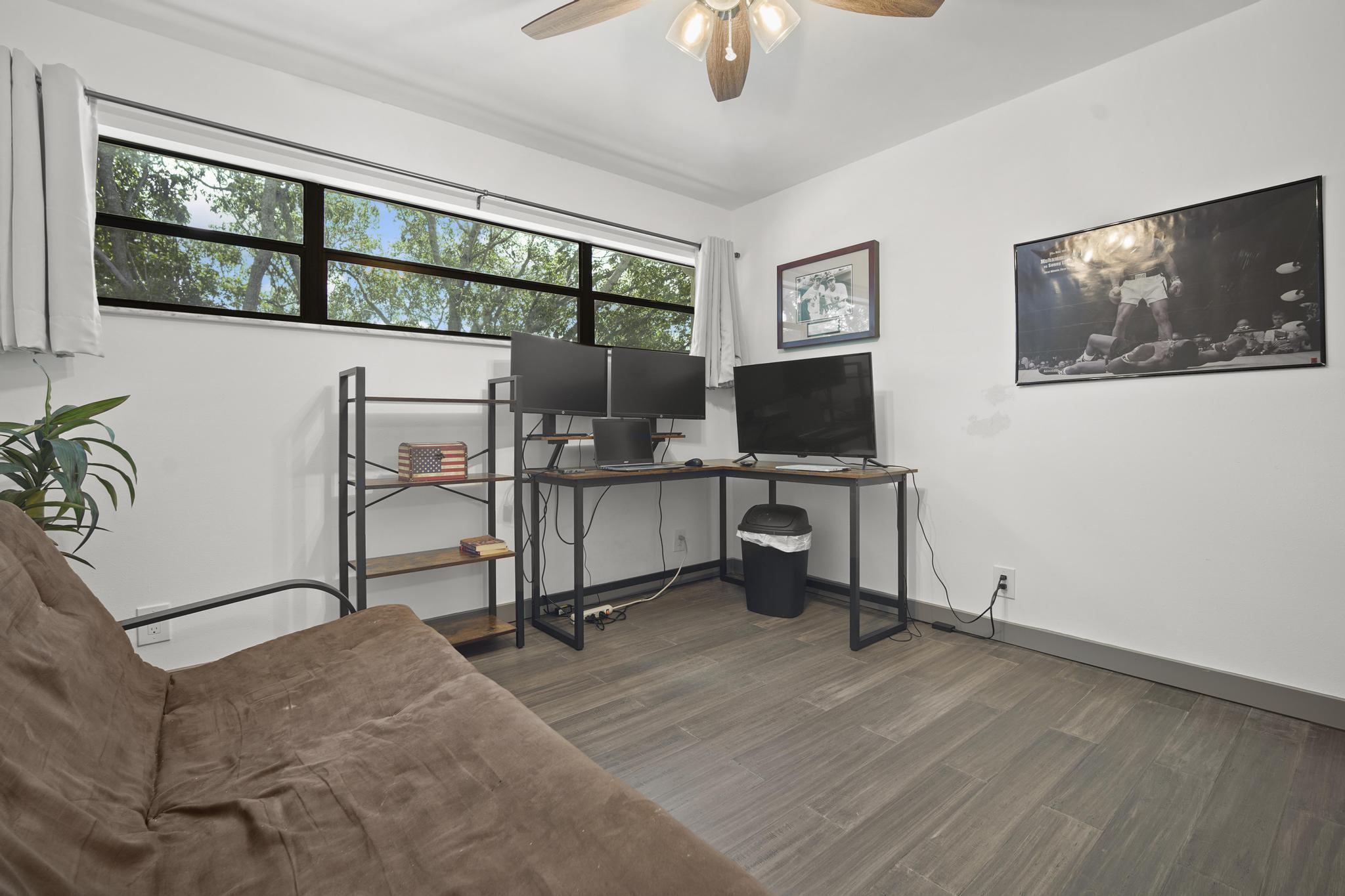 149 Northwest 70th Street, Unit 214C Boca Raton, FL 33487 - Photo 24 of 35 a view of a workspace with furniture and a window