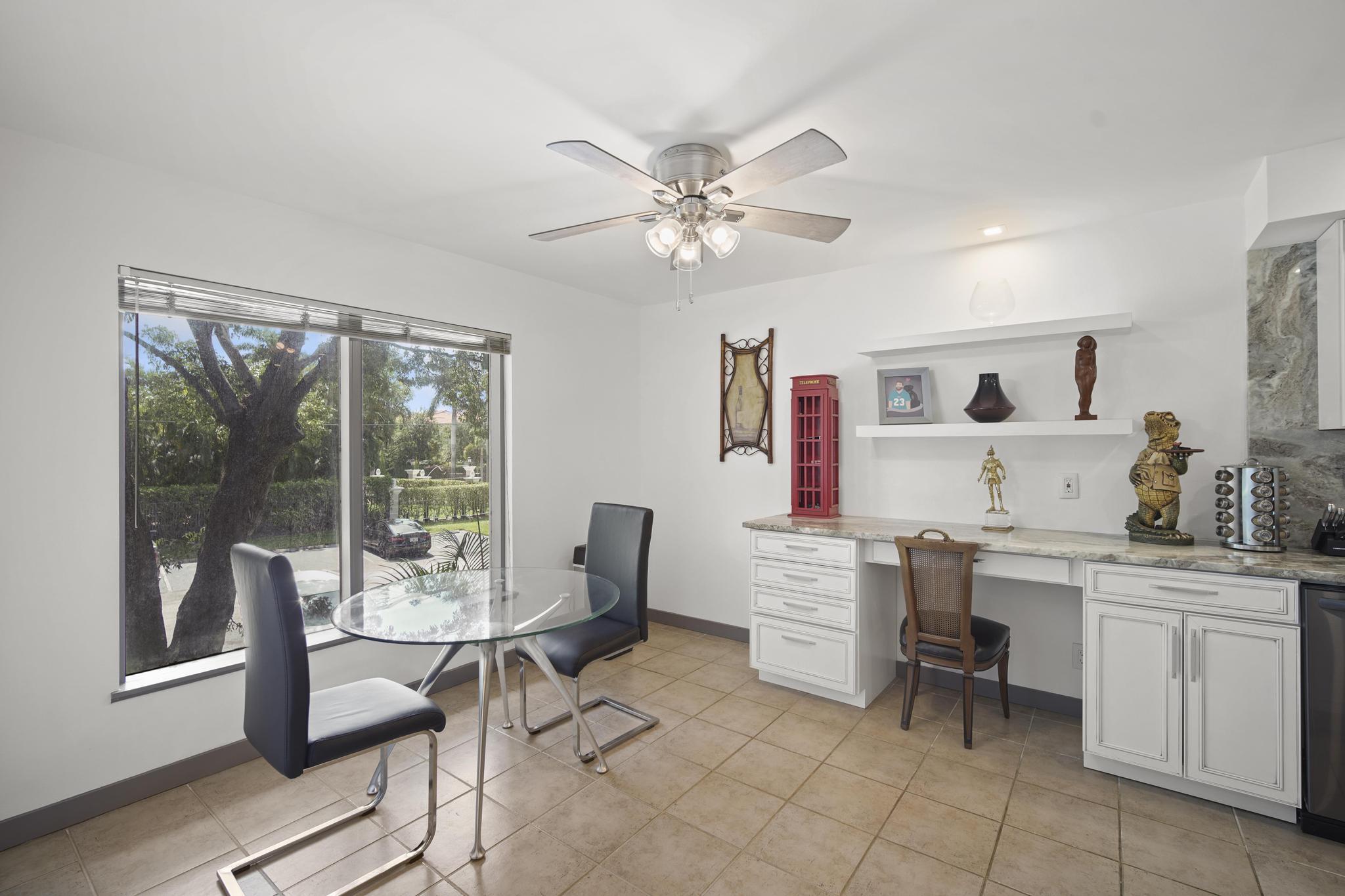 149 Northwest 70th Street, Unit 214C Boca Raton, FL 33487 - Photo 10 of 35 a workspace with furniture and window