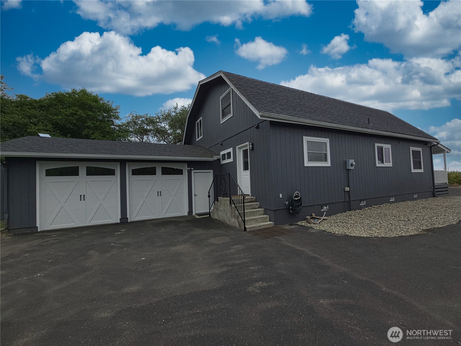 240 Stringtown Road Ilwaco, WA 98624 - Photo 22 of 39 a backyard of a house with table and sofas