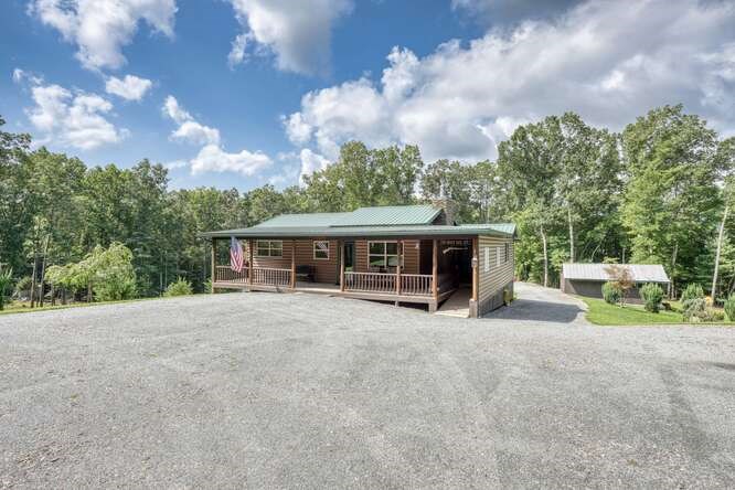 245 Panther Hill Road Murphy, NC 28906 - Photo 12 of 57 a view of a house with a yard and sitting area
