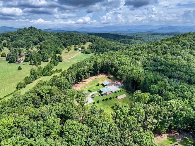 245 Panther Hill Road Murphy, NC 28906 - Photo 2 of 57 a view of a garden with an outdoor space