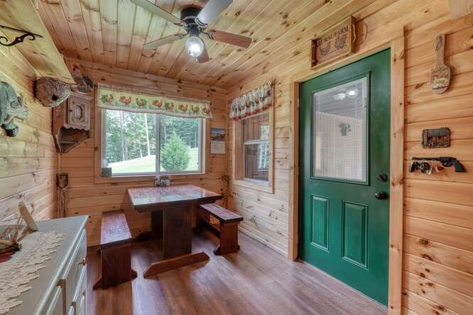 245 Panther Hill Road Murphy, NC 28906 - Photo 24 of 57 a dining room with furniture a rug and wooden floor