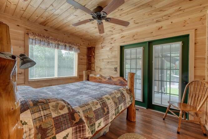 245 Panther Hill Road Murphy, NC 28906 - Photo 25 of 57 a bed sitting in a spacious bedroom next to a window