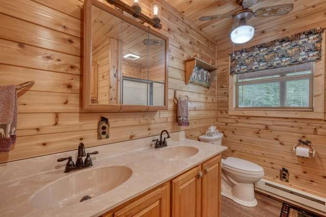 245 Panther Hill Road Murphy, NC 28906 - Photo 27 of 57 a bathroom with a sink vanity and a mirror