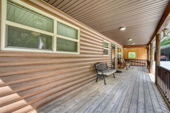245 Panther Hill Road Murphy, NC 28906 - Photo 42 of 57 a balcony with furniture and wooden floor