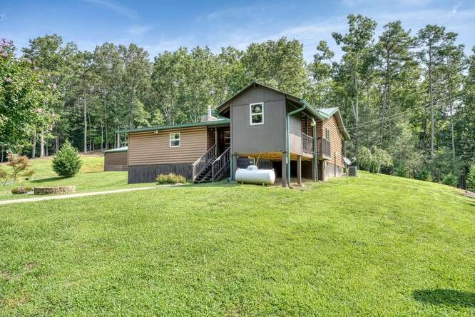 245 Panther Hill Road Murphy, NC 28906 - Photo 8 of 57 a front view of a house with garden